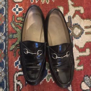 Well loved black leather loafers with horse bit